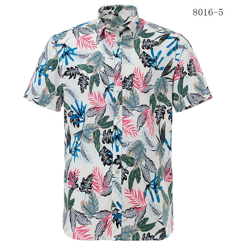 Short-sleeve shirt with tropical leaf pattern on a white background