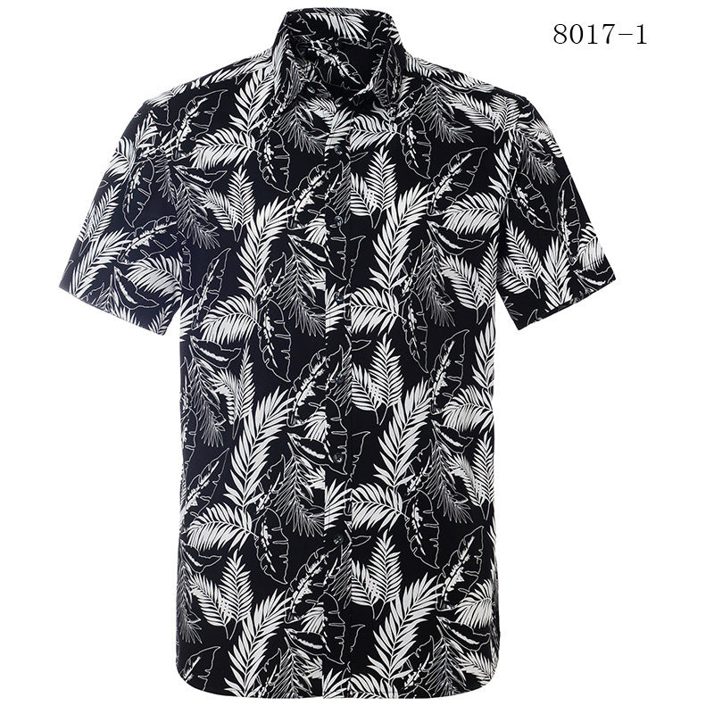 Black and white leaf patterned shirt on a white background